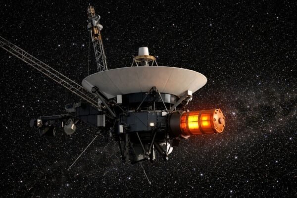 Voyager spacecraft in deep space with a glowing radioisotope thermoelectric generator (RTG) module providing power, illustrating the thermoelectric effect used in long-duration space missions.