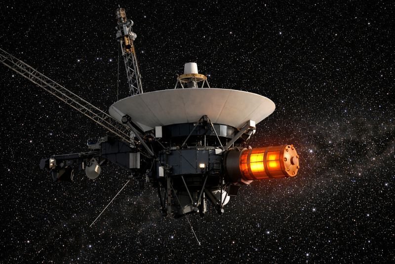 Voyager spacecraft in deep space with a glowing radioisotope thermoelectric generator (RTG) module providing power, illustrating the thermoelectric effect used in long-duration space missions.