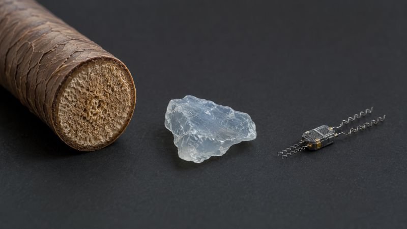 Scale comparison showing a human hair cross-section, a microplastic fragment, and a conceptual microbot unit for ocean cleanup research